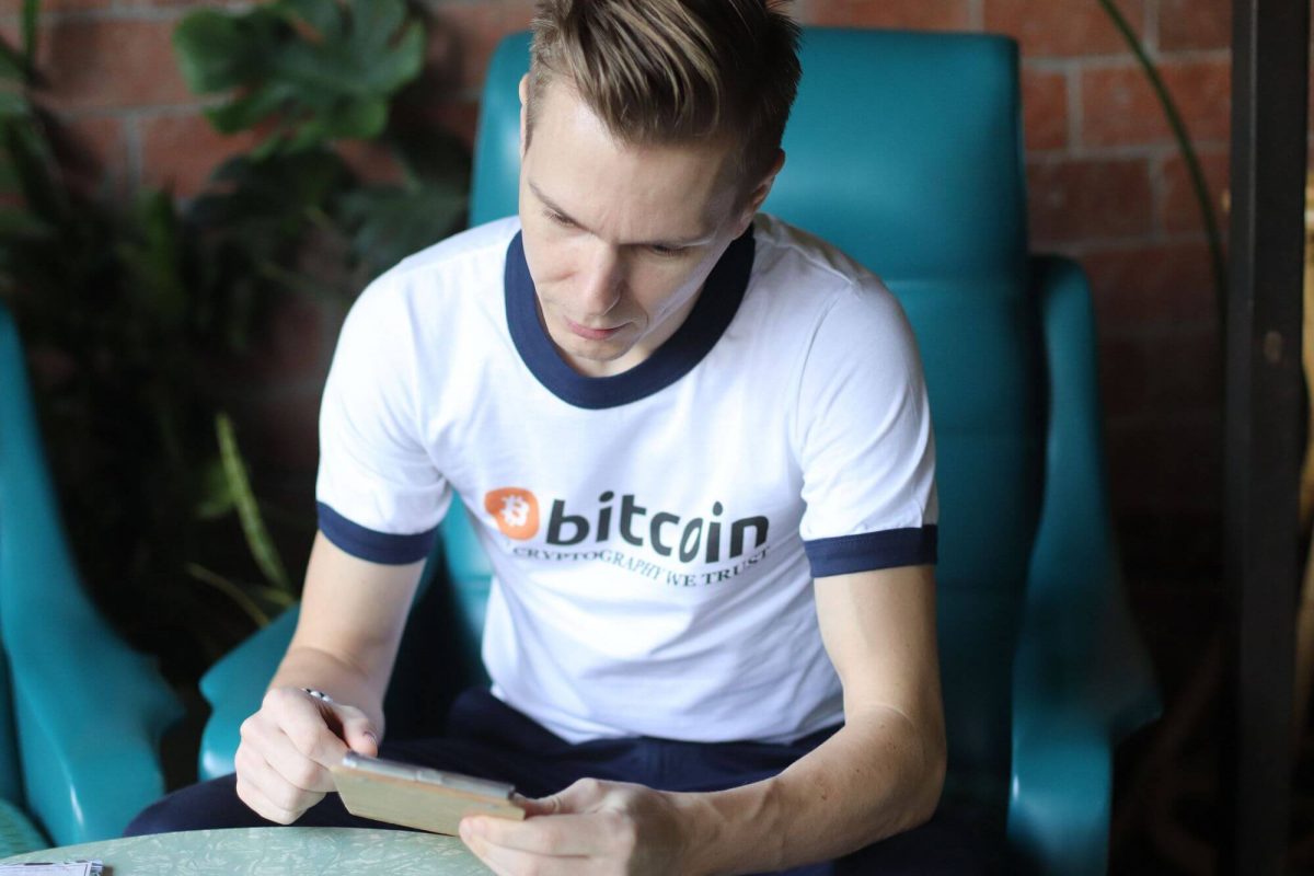 Enjoying time In Cryptography We Trust Bitcoin T-shirt at coffee shop